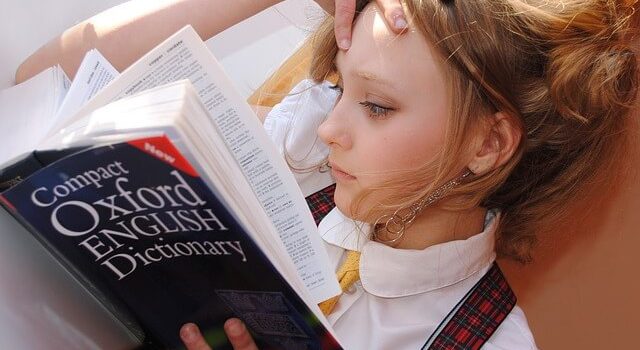 Girl studying the Oxford Dictionary
